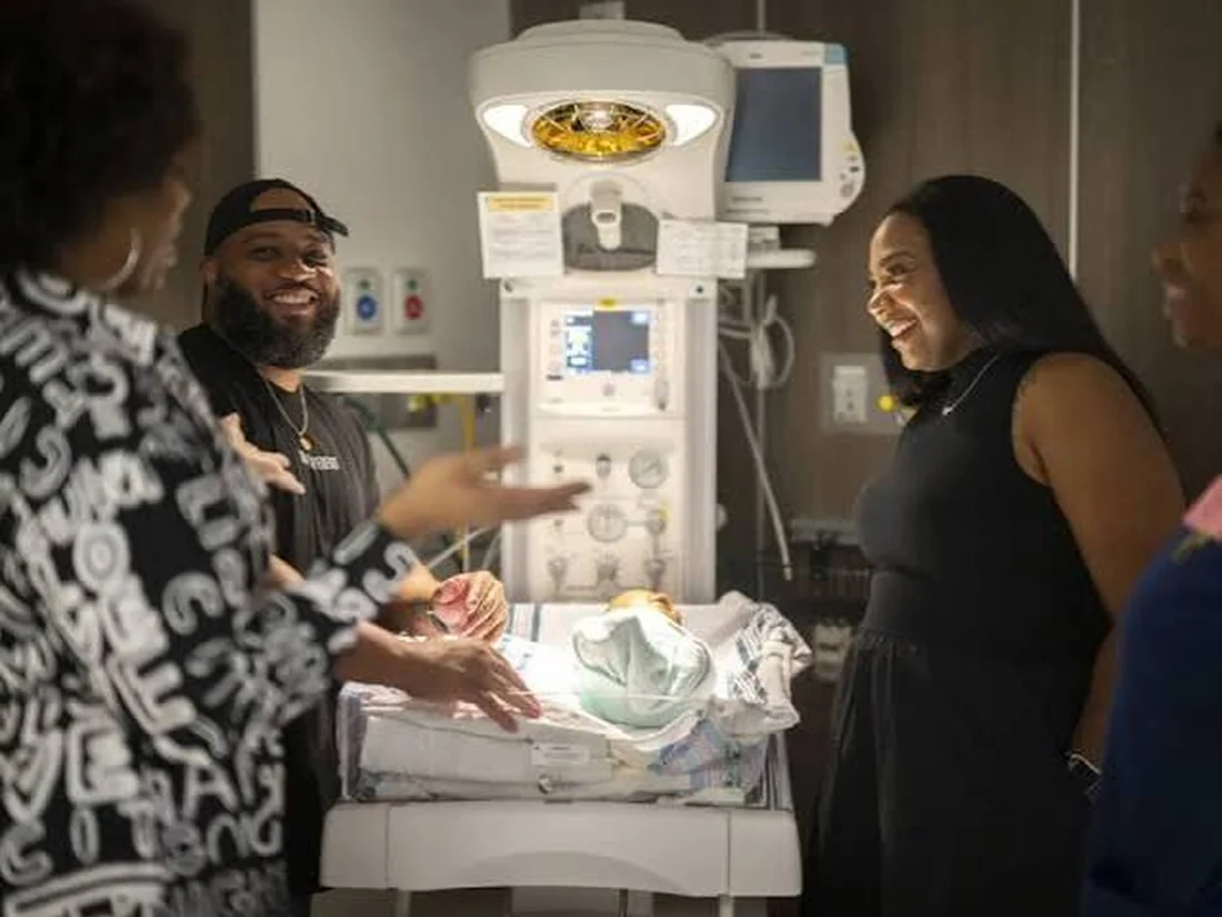 Kyra Betts in a hospital room discussing maternal health care